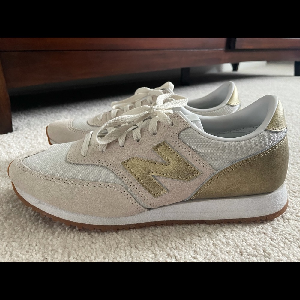 Gold and cream New Balance/JCrew sneakers